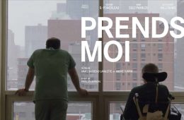 Prends Moi - A nurse unhappily looks out a window next to a person in a wheelchair. It is snowing outside.